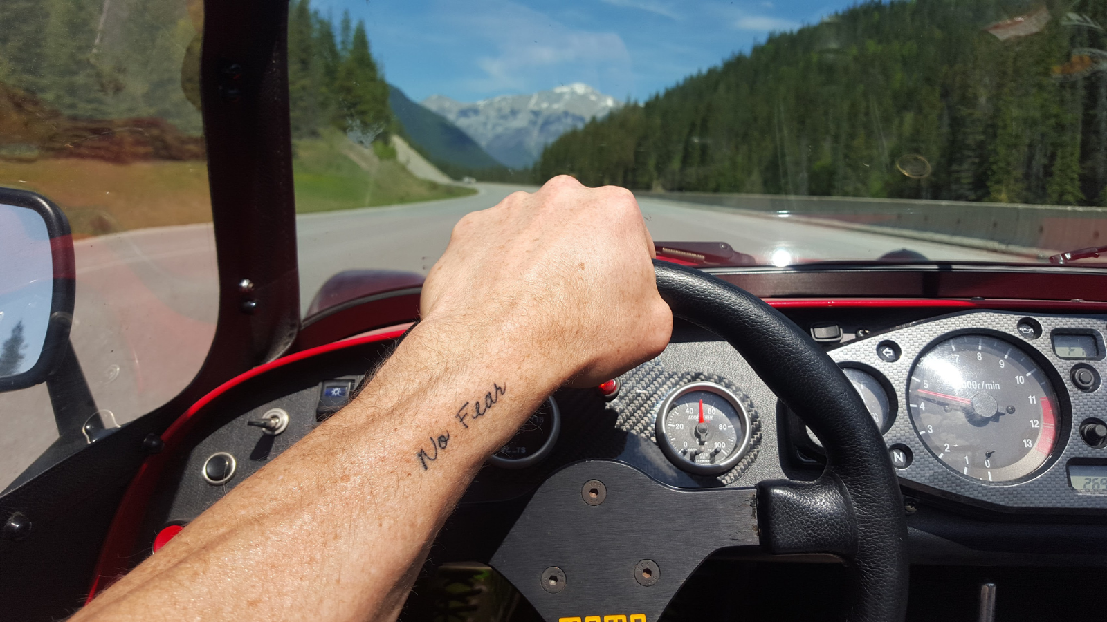 "no fear" tattoo on arm