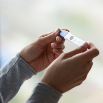 Woman Holding Pregnancy Test