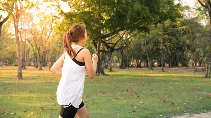 Image of woman running in a park