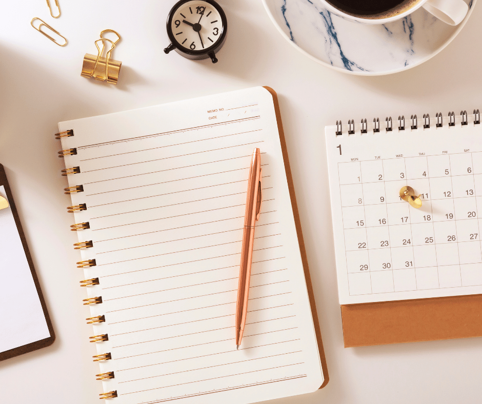 Notebook, calendar, and clock