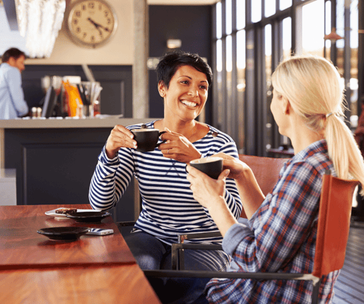 Friends talking and having coffee