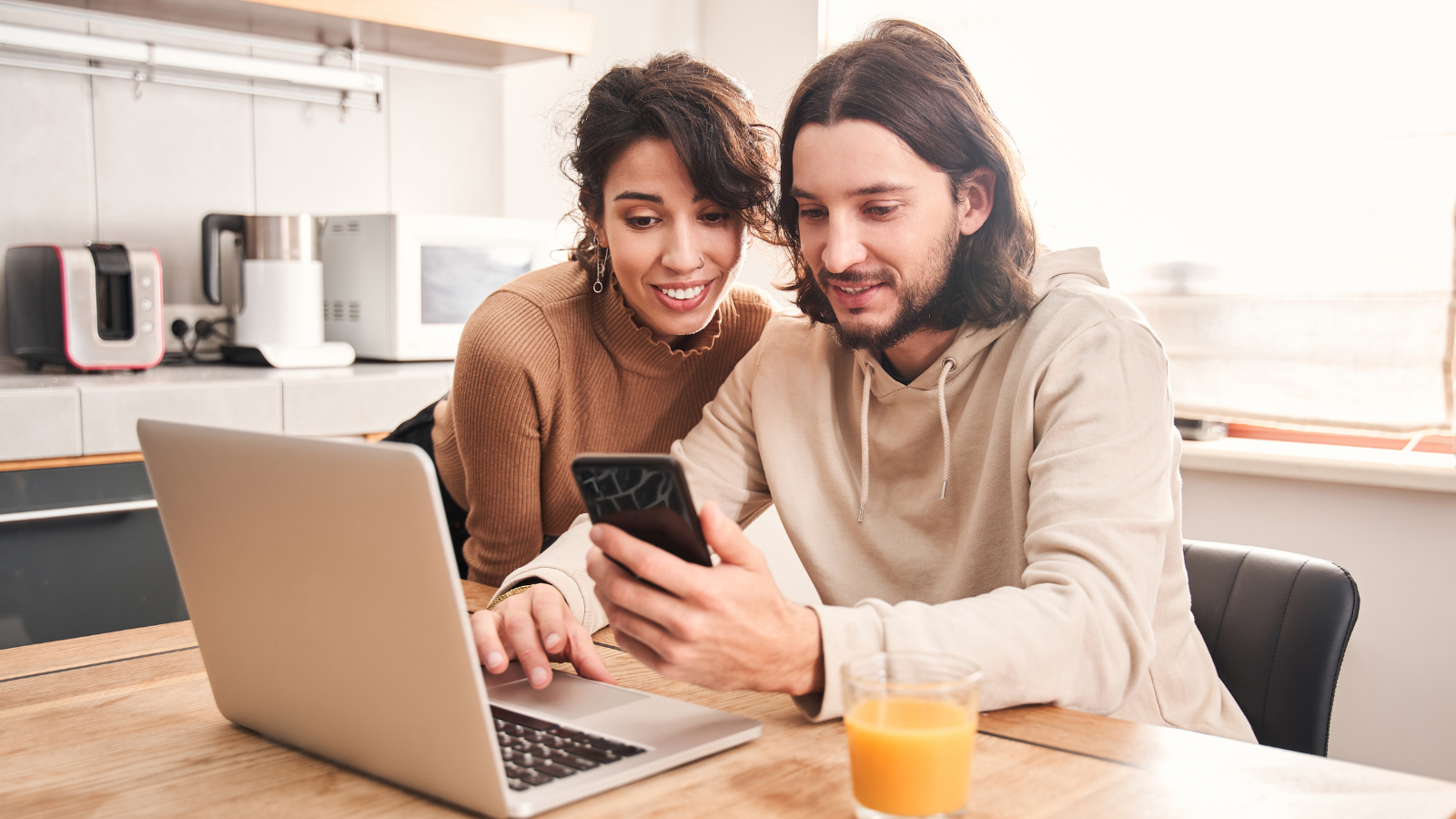 A couple looking at a phone